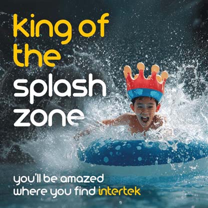 A young boy making a splash on an inflatable in a pool while wearing a crown