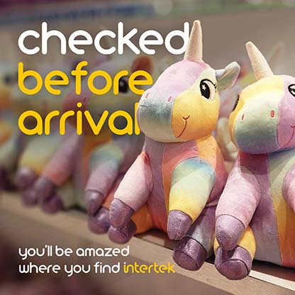 A row of colorful unicorn plush toys on a shelf