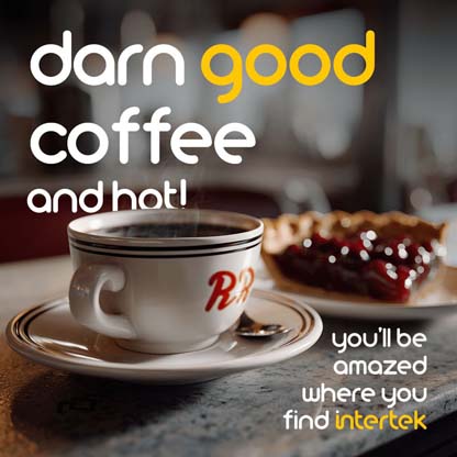 A cup of coffee sitting on a table next to a slice of cherry pie